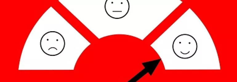 Indicador de emociones, flecha apunta a cara sonriente.